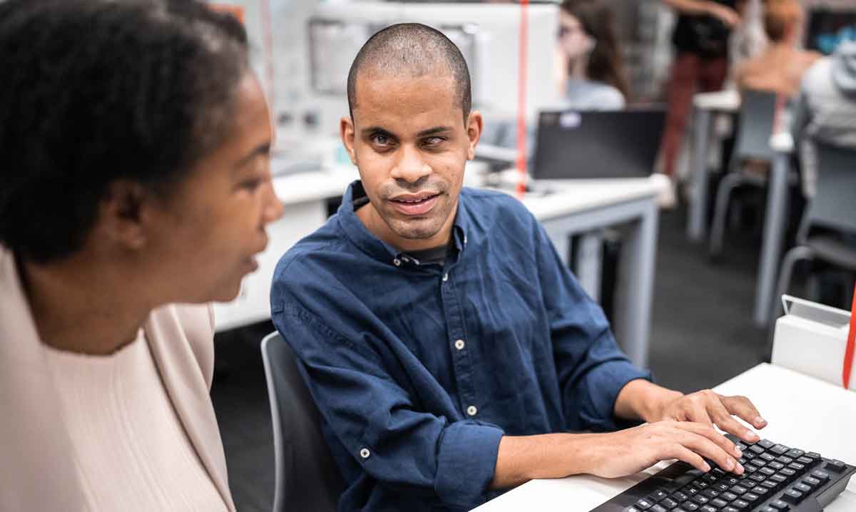 Man working on keyboard skills.