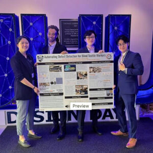 Four members of Mechanical Engineering team from Johns Hopkins Whiting School Of Engineering hold their Design Day project titled Automating Defect Detection for Blind Textile Workers.