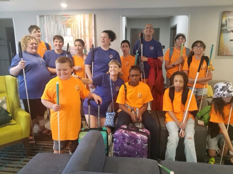 Group of kids ready to go on an adventure. All wearing BISM orange t-shirts.