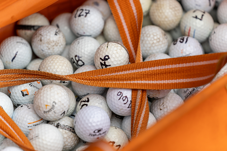basket of golf balls all numbers for the Helicopter ball drop