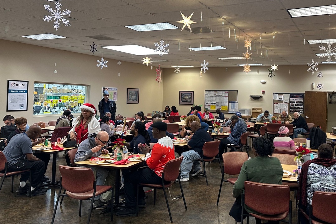 Associates enjoying 2025 holiday party in Baltimore cafeteria